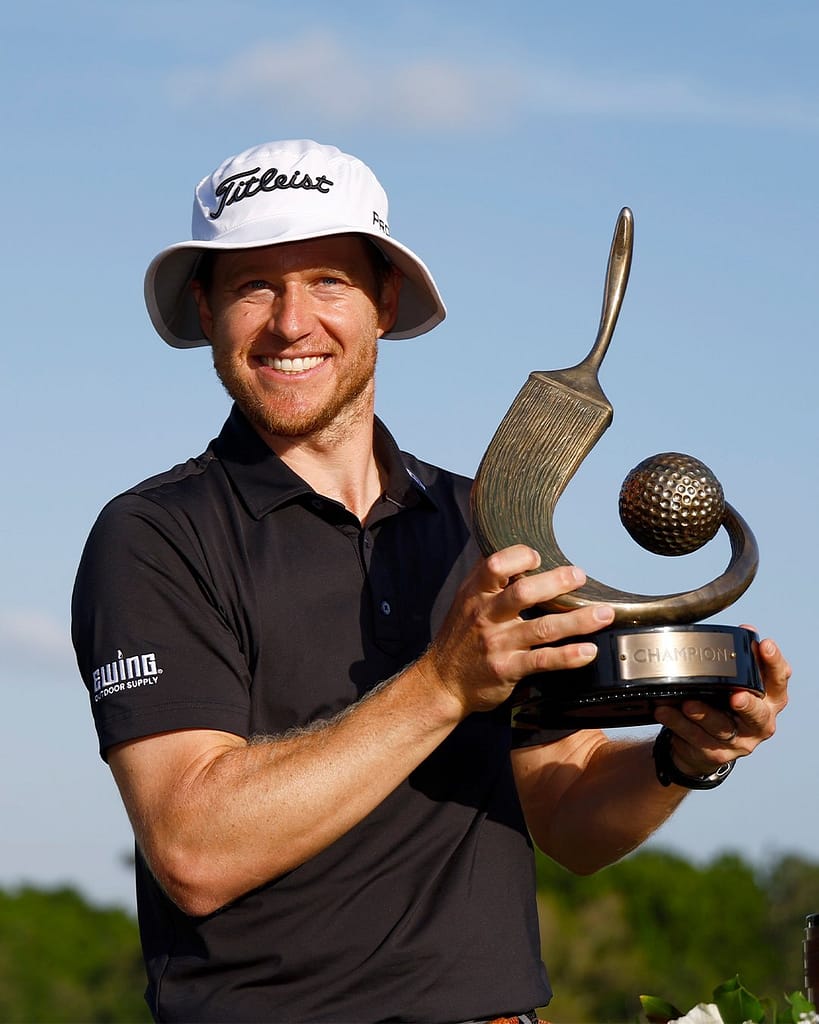 Peter malnati holding Trophy