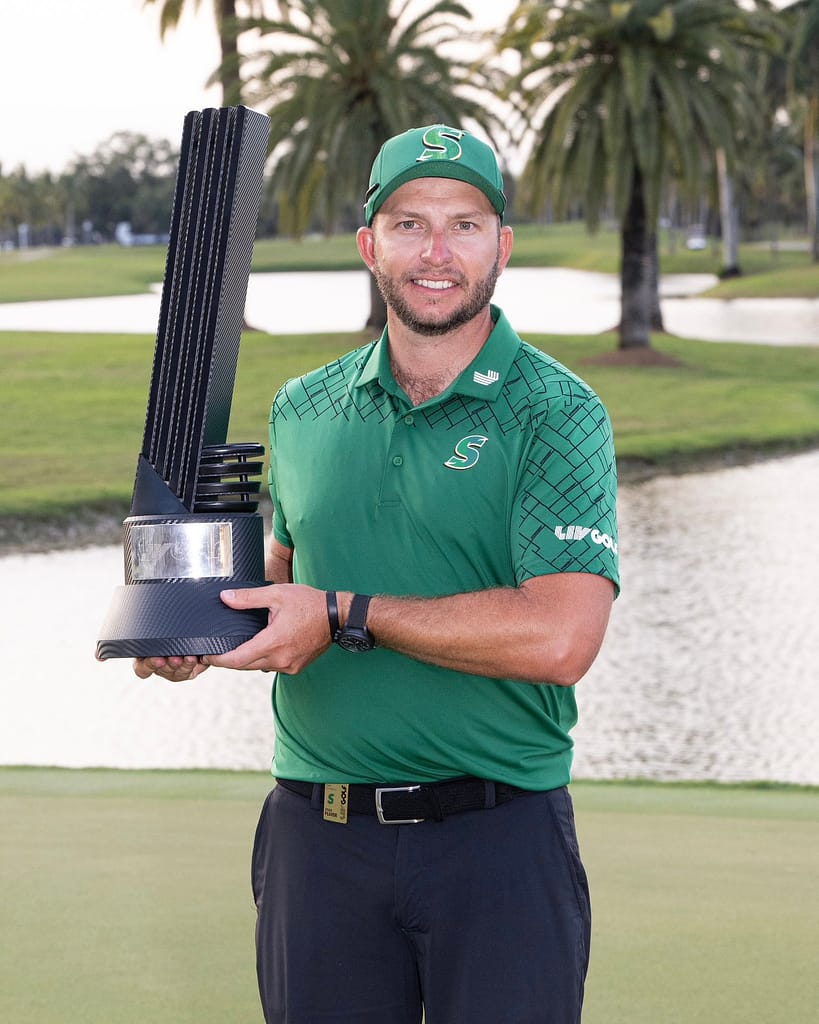 Dean Burmester holding trophy at Miami 