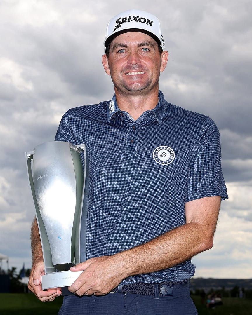 Keegan holding BMW championship trophy